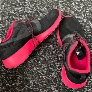 Pink and black Nike sneakers